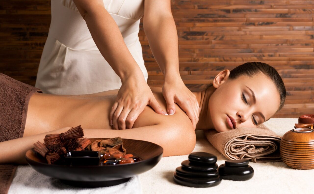 woman-with-closed-eyes-having-massage-of-body-